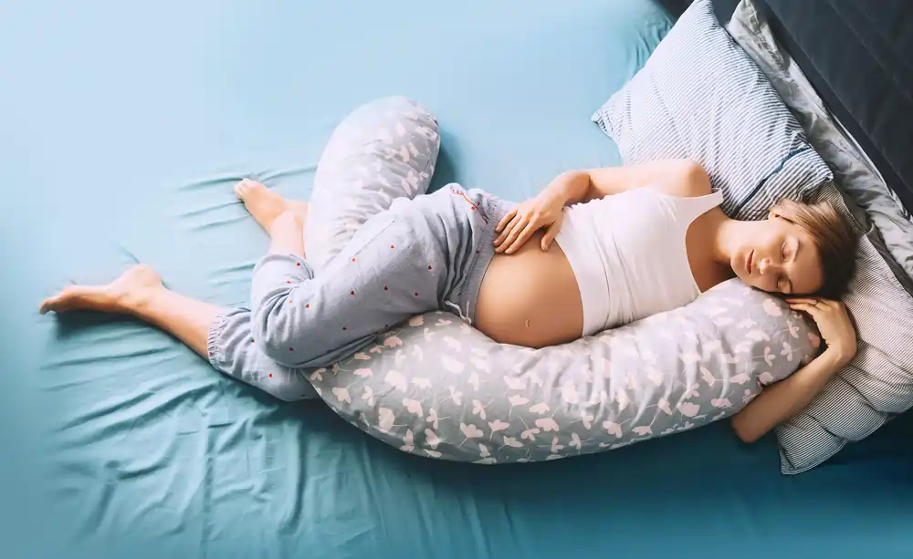 Pregnancy & Sleep: Tips, Sleep Positions, & Issues