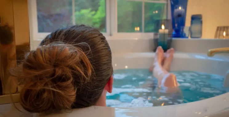 a women relaxing in a bathtub