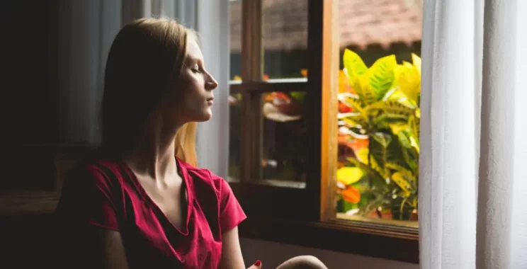 a women sitting by the window